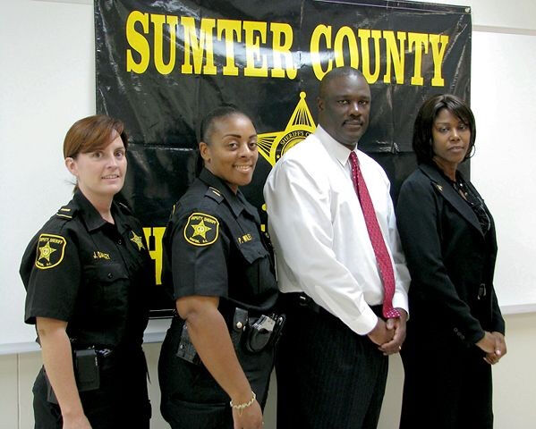 Sumter County Sheriff Anthony Dennis and Melissa Addison (far right)